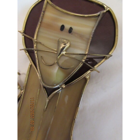 Stained glass leaves and lion handmade ornaments hang in window - Picture 6 of 7